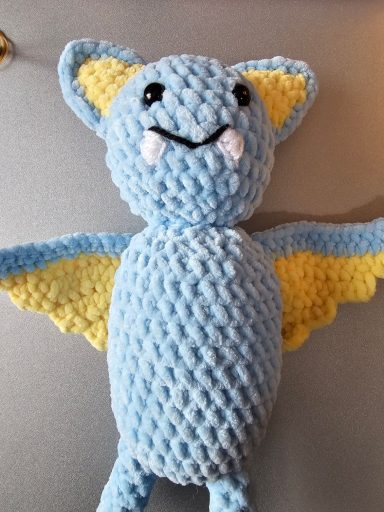 pale blue and yellow bat plushie